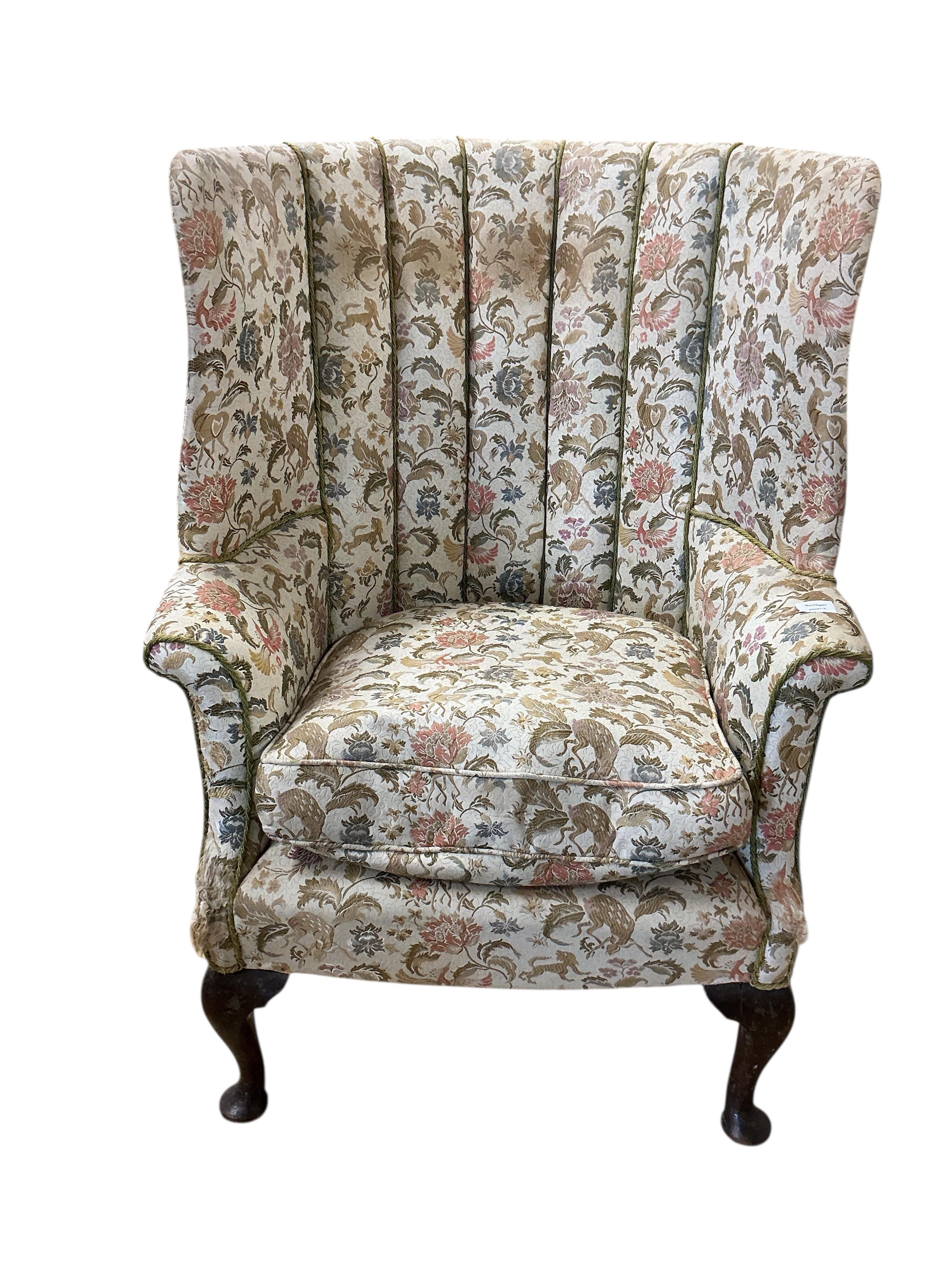 A George II style upholstered barrel-back wing armchair, width 80cm, depth 62cm, height 110cm